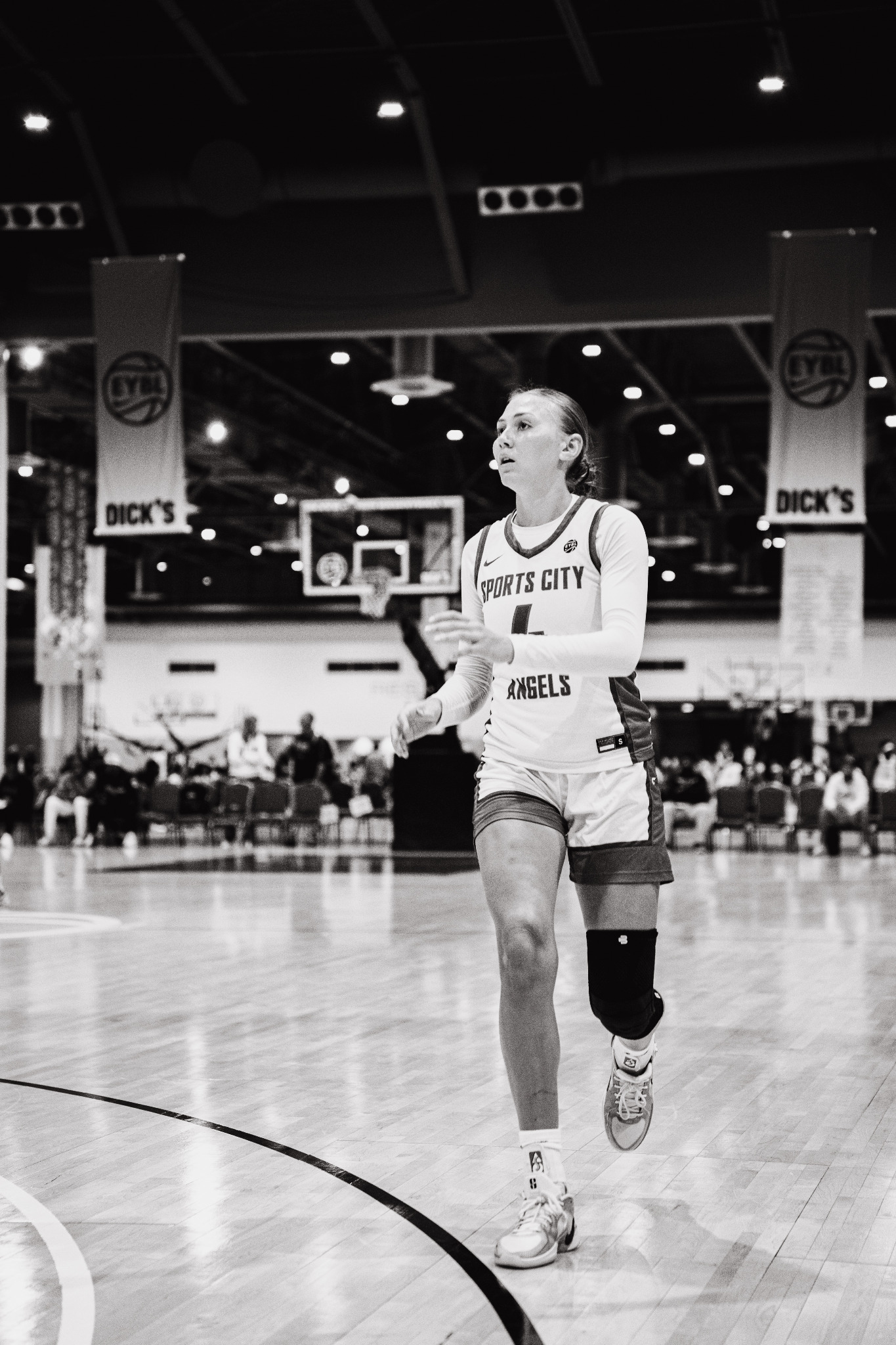 Female basketball player on the court at a major youth basketball event